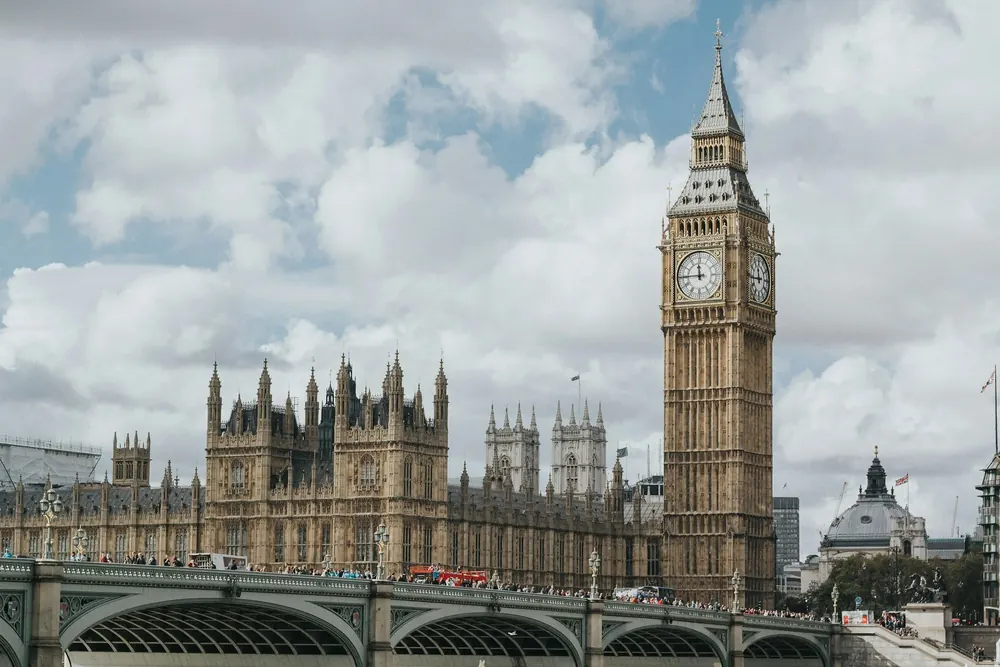 Houses of Parliament and Big Ben in London with a view of Westminster Bridge.